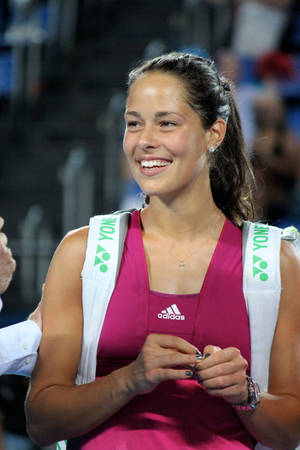 Ana Ivanovic Celebrating Victory On A Tennis Court Wallpaper