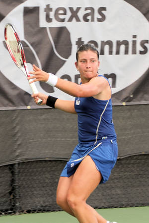 Anastasija Sevastova In Action During A Tennis Match. Wallpaper