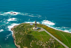 Ancient Majesty - The Tower Of Hercules Against A Serene Sky Wallpaper