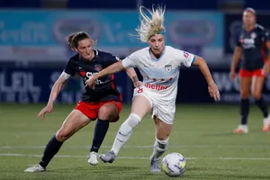 Andi Sullivan In Action On The Field Wallpaper