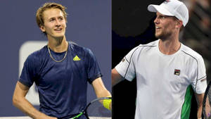 Andreas Seppi And Sebastian Korda Engaging In A Competitive Tennis Match. Wallpaper