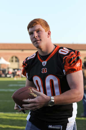 Andy Dalton Bengals Uniform With Football Wallpaper