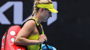 Angelique Kerber In Yellow Outfit Wallpaper