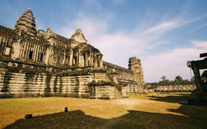Angkor Wat Ruins In Cambodia Beneath Blue Sky Wallpaper