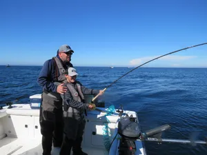 Angler With Fishing Rod At The River Wallpaper