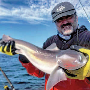 Anglerwith Caught Dogfish Wallpaper