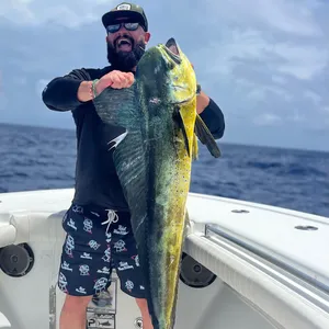 Anglerwith Caught Dolphinfish Wallpaper