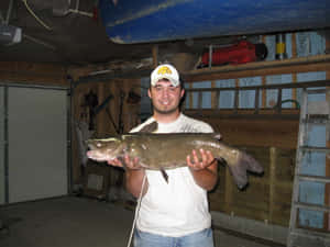 Anglerwith Channel Catfish Catch Wallpaper