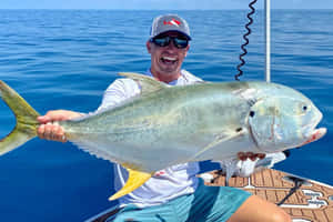 Anglerwith Large Jack Fish Wallpaper