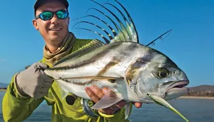 Anglerwith Roosterfish Catch Wallpaper