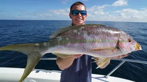 Anglerwith Yellowtail Snapper Catch Wallpaper