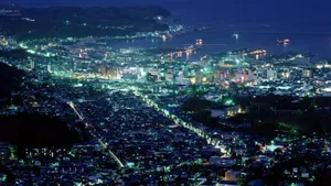 Anime Night City With A Bustling Port Wallpaper