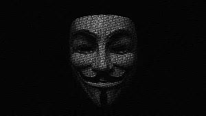 Anonymous Hacker Mask – Unmasking The Cyber Security Threat Wallpaper