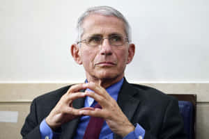 Anthony Fauci Giving A Speech Wallpaper