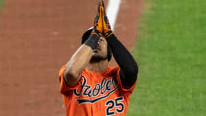 Anthony Santander In Action During A Baseball Game Wallpaper
