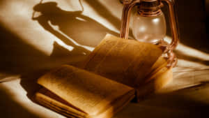 Antique Book And Lantern Wallpaper