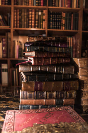 Antique_ Books_ Stacked_ Dark_ Library_ Aesthetic.jpg Wallpaper