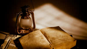 Antique Lantern And Book Wallpaper