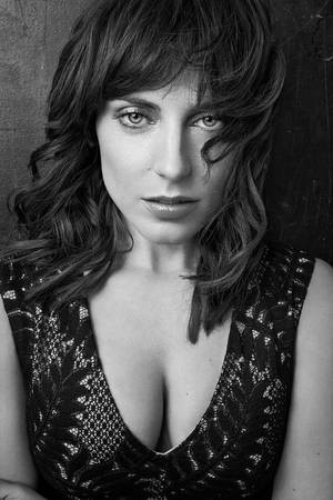 Antje Traue Radiating Elegance In Black Top Wallpaper