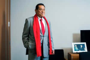 Antonio Inoki In A Stylish Gray Suit Wallpaper