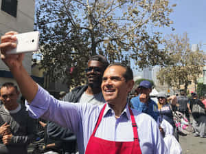Antonio Villaraigosa Taking Picture Wallpaper