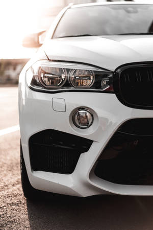 Apple Carplay Interface On Iphone Against A Car Dashboard Backdrop Wallpaper