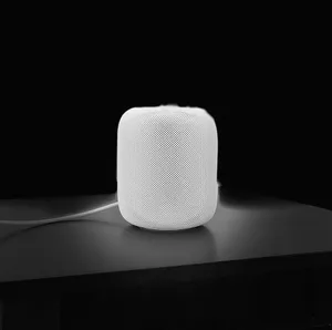 Apple Homepod On A Wooden Table Wallpaper