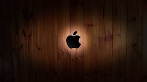Apple Logo Crafted On Wood. Wallpaper