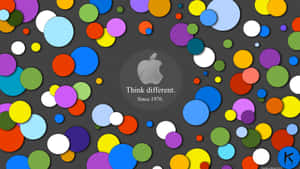 Apple Logo With Colorful Circles On A Dark Background Wallpaper