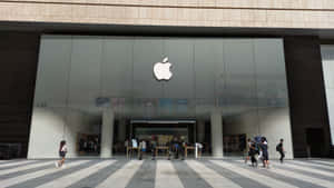 Apple Store Exteriorwith Pedestrians Wallpaper