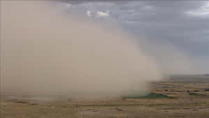 Approaching Dust Storm Over Plains Wallpaper