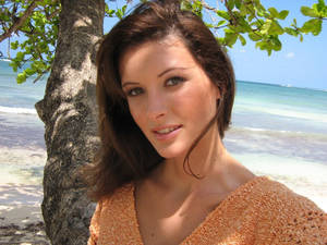 April Bowlby Near A Tree At The Beach Wallpaper