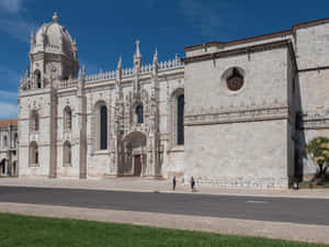 Architectural Masterpiece - Side Exterior View Of Mosteiro Dos Jeronimos, Lisbon Wallpaper