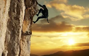 Arduous Climb During Sunset Wallpaper