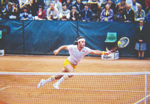 Argentine Tennis Legend Guillermo Vilas In Action During 1978 French Open Wallpaper