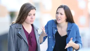 Argument Between Two Women Outdoors.jpg Wallpaper