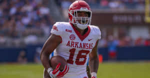 Arkansas Football Player Treylon Burks Action Shot Wallpaper