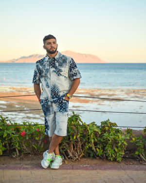 Arman Tsarukyan At Beach Under Dreamy Sky Wallpaper