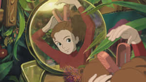 Arrietty And Her Family In A Beautiful Garden Scene. Wallpaper