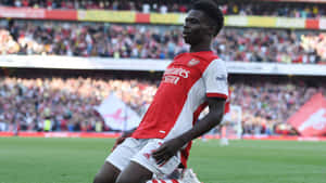 Arsenal Player Celebrationat Stadium Wallpaper