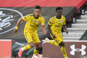 Arsenal Playersin Action During Match Wallpaper