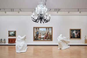 Art Gallery Interiorwith Paintingsand Sculptures Wallpaper