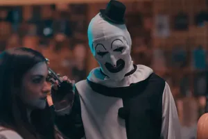 Art The Clown Threatening Woman With Gun Wallpaper