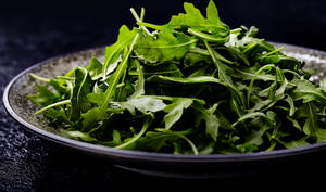 Arugula Leaves Pile On Platter Wallpaper