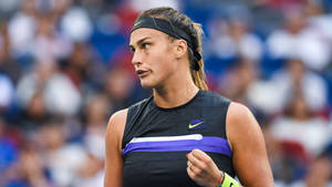 Aryna Sabalenka In Action - Tennis Pro With Black Headband Wallpaper