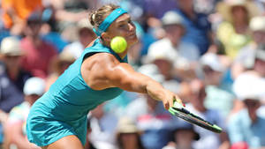 Aryna Sabalenka Reaching For Ball Wallpaper