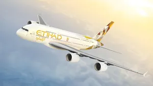 Ascending Etihad Airplane In Sunrise Wallpaper