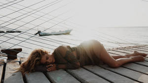 Ashley Benson On A Boat Dock Wallpaper