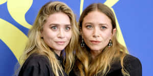 Ashley Olsen Posing Elegantly In A Stunning Dress Wallpaper