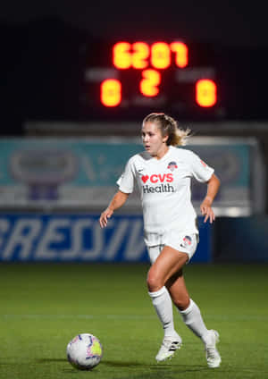 Ashley Sanchez Scoring A Goal During A Professional Soccer Match. Wallpaper